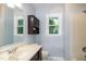 Bathroom featuring a vanity, wood cabinet, and a shower/tub combination at 2532 Rolling Meadows Dr, Raleigh, NC 27603