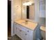 This bathroom features a white vanity with an off-white sink and a large mirror at 2532 Rolling Meadows Dr, Raleigh, NC 27603