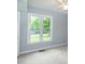 Bedroom with a large window providing natural light and a view of the yard at 2532 Rolling Meadows Dr, Raleigh, NC 27603