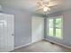 Bedroom featuring a double closet and a window overlooking the yard at 2532 Rolling Meadows Dr, Raleigh, NC 27603