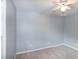 Spacious bedroom with light grey walls, beige carpet, and a ceiling fan at 2532 Rolling Meadows Dr, Raleigh, NC 27603
