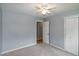Bedroom with closet space and a view to a hallway with hardwood flooring at 2532 Rolling Meadows Dr, Raleigh, NC 27603
