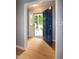 Bright foyer with hardwood floors and a welcoming blue front door at 2532 Rolling Meadows Dr, Raleigh, NC 27603