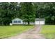 A beautiful view of this home with a long driveway and an attached two-car garage at 2532 Rolling Meadows Dr, Raleigh, NC 27603