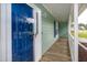 Inviting front porch with a striking blue door and fresh white trim at 2532 Rolling Meadows Dr, Raleigh, NC 27603