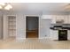 Open kitchen featuring white cabinets, blue countertops and pantry access at 2532 Rolling Meadows Dr, Raleigh, NC 27603