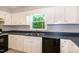 Spacious kitchen showcasing modern appliances, ample cabinet space, and a bright window at 2532 Rolling Meadows Dr, Raleigh, NC 27603