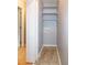 Small laundry room features utility connections and shelving at 2532 Rolling Meadows Dr, Raleigh, NC 27603