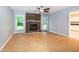 Spacious living room features a cozy brick fireplace and plenty of natural light at 2532 Rolling Meadows Dr, Raleigh, NC 27603