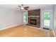 Bright living room with hardwood floors, fireplace and access to the outdoors at 2532 Rolling Meadows Dr, Raleigh, NC 27603