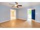 Open living area with hardwood floors, ceiling fan, and views into adjacent rooms at 2532 Rolling Meadows Dr, Raleigh, NC 27603