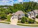 Aerial view of a charming home with well-manicured landscaping, a spacious driveway, and a two-car garage at 2538 Tuffeto, Apex, NC 27502