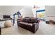 Spacious bedroom with carpet flooring, fun lighting, and a brown leather couch at 2538 Tuffeto, Apex, NC 27502