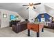 Large carpeted bedroom boasts a ceiling fan, TV, and foosball table at 2538 Tuffeto, Apex, NC 27502