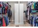 Spacious walk-in closet with ample shelving and hanging space for clothes and accessories at 2538 Tuffeto, Apex, NC 27502