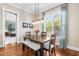 Cozy dining room featuring hardwood floors, a bench seat, and a view into the Primary bedroom at 2538 Tuffeto, Apex, NC 27502