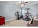 Carpeted exercise room features fitness equipment and a piano at 2538 Tuffeto, Apex, NC 27502