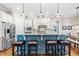 Contemporary kitchen featuring a breakfast bar, granite countertops, stainless steel appliances, and custom cabinets at 2538 Tuffeto, Apex, NC 27502