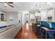 Open concept living room with hardwood floors, breakfast bar and seating with view to entry at 2538 Tuffeto, Apex, NC 27502