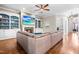 Living room with built-in shelves, cozy fireplace, and a large flatscreen TV at 2538 Tuffeto, Apex, NC 27502