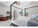 Main bedroom with seating area and door to the bath with a four-poster bed and carpet at 2538 Tuffeto, Apex, NC 27502