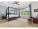 Main bedroom with tray ceiling, carpet, seating area and a wall of windows at 2538 Tuffeto, Apex, NC 27502