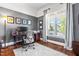 Spacious office features a large window and hardwood floors for a comfortable workspace at 2538 Tuffeto, Apex, NC 27502