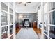 Office space with a large gray rug, wood desk, and view through the glass doors at 2538 Tuffeto, Apex, NC 27502