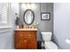 Traditional powder room with wood wainscoting, granite countertop and oil rubbed bronze fixtures at 2538 Tuffeto, Apex, NC 27502