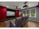 Home theater room with projector, movie screen, and comfortable seating at 2538 Tuffeto, Apex, NC 27502