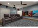 Home theater boasts tiered seating, projector, and movie-themed decor at 2538 Tuffeto, Apex, NC 27502