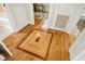 Beautiful hardwood floors with intricate design leading to dining area and bathroom at 26 Rogerson Dr, Chapel Hill, NC 27517