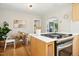 Stylish kitchen showcasing stainless steel appliances, white countertops, and an eat-in breakfast area at 26 Rogerson Dr, Chapel Hill, NC 27517
