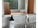 Close up of soap dispenser and books by the kitchen window at 26 Rogerson Dr, Chapel Hill, NC 27517