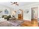 Living room with hardwood floors, neutral decor, and an open doorway to the kitchen at 26 Rogerson Dr, Chapel Hill, NC 27517