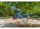 Community playground featuring a slide, climbing structure, and swings, providing a fun and safe play area at 26 Rogerson Dr, Chapel Hill, NC 27517