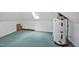 Attic with a water heater, skylight, and neutral carpet at 2606 Sherbrooke Dr, Durham, NC 27712
