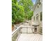 Backyard deck offers different levels, with surrounding lush greenery for outdoor enjoyment and privacy at 2606 Sherbrooke Dr, Durham, NC 27712