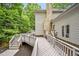 Spacious backyard deck featuring multiple levels and walkways, all surrounded by mature trees at 2606 Sherbrooke Dr, Durham, NC 27712
