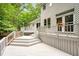 Spacious white painted backyard deck perfect for entertaining or relaxing with multiple access points to the home at 2606 Sherbrooke Dr, Durham, NC 27712