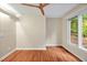 Bedroom features neutral walls, wood-look floors, and a ceiling fan at 2606 Sherbrooke Dr, Durham, NC 27712