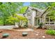 Lovely home exterior with stone accents, a small front yard tree, and inviting entrance steps at 2606 Sherbrooke Dr, Durham, NC 27712