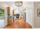 Bright kitchen with skylights, white cabinets, stainless appliances, and access to the deck at 2606 Sherbrooke Dr, Durham, NC 27712