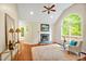 Inviting living room with fireplace, vaulted ceiling, and a large arched window at 2606 Sherbrooke Dr, Durham, NC 27712
