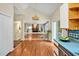 Open living space boasts hardwood floors, open floor plan with kitchen and living room view, and sliding glass door at 2606 Sherbrooke Dr, Durham, NC 27712