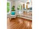 Bright living space featuring hardwood floors, a cozy chair, and large windows with views of the outdoors at 2606 Sherbrooke Dr, Durham, NC 27712