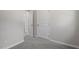 Hallway area featuring gray carpet, white trim, and white doors at 2612 Glenbrook Dr, Durham, NC 27704