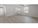 Bright living space with modern flooring and a white entry door at 2612 Glenbrook Dr, Durham, NC 27704