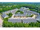 Stunning aerial view of a townhouse community with lush greenery and a refreshing community pool at 2635 Asher View Ct, Raleigh, NC 27606