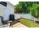 Fenced backyard featuring a grill, small yard, and access to an outside door at 2635 Asher View Ct, Raleigh, NC 27606